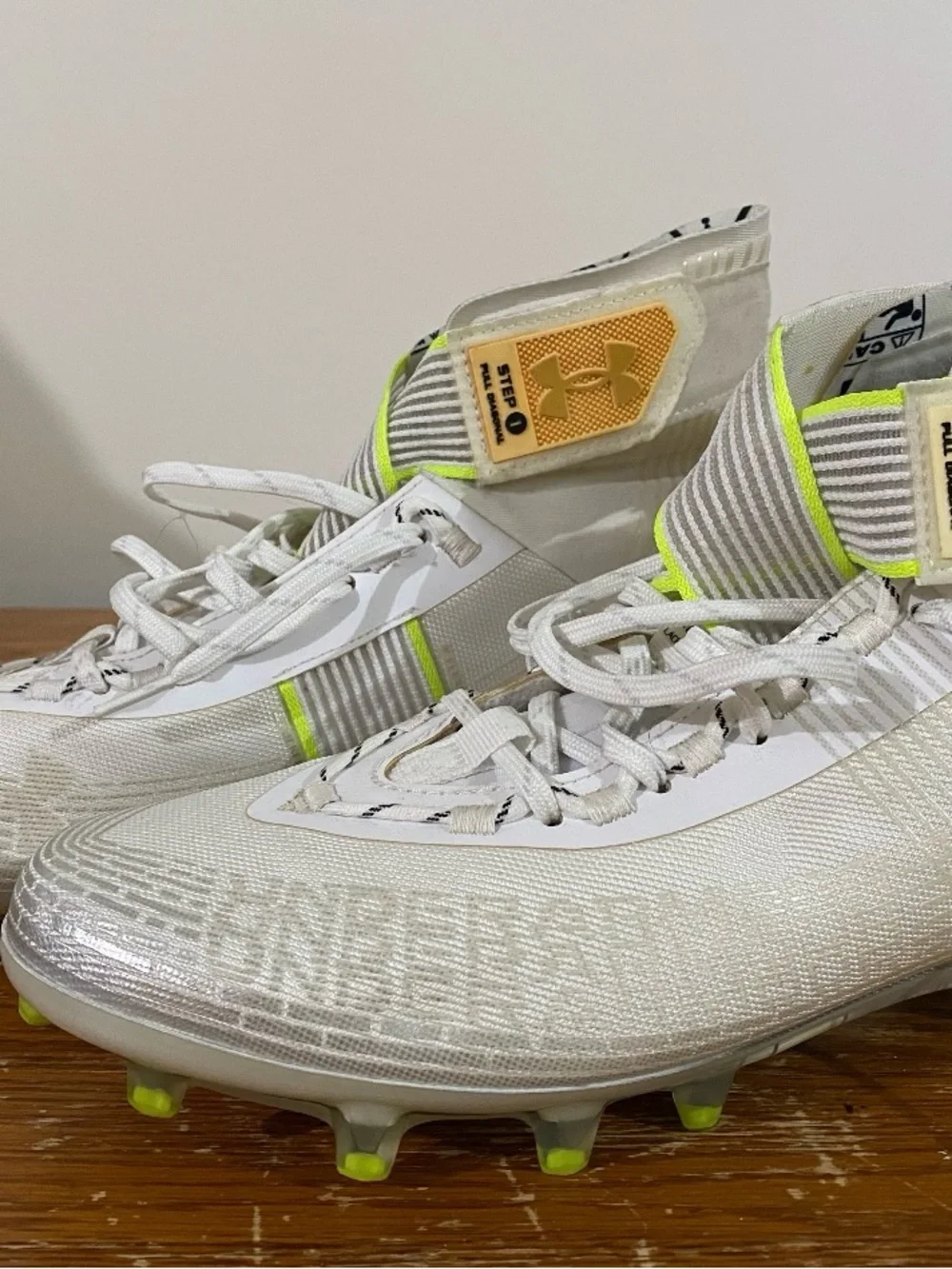 Under Armour men's White Cleats with Neon Yellow Highlights